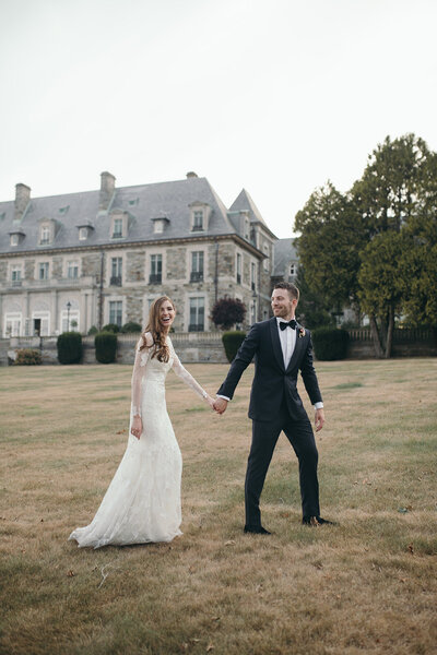 Bride and groom on their wedding day holding hands