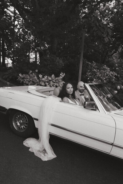 bride and groom in vintage getaway car seattle 