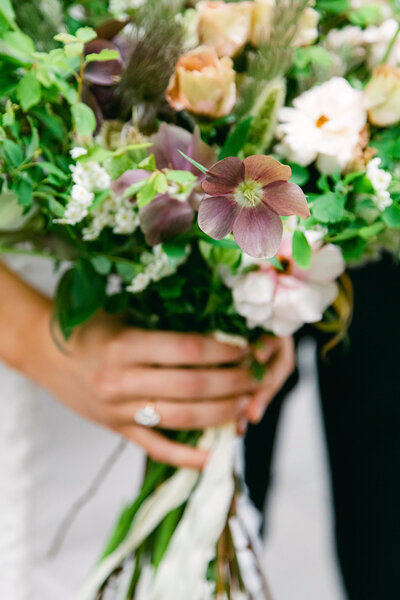 A beautiful wedding bouquet with purple hellebore