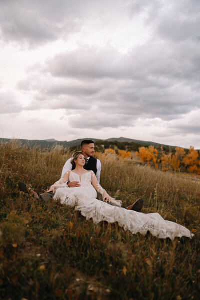 Couple sitting in tall grass