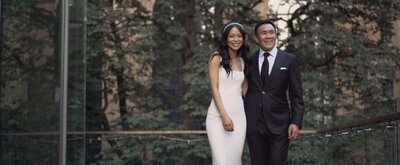 Bride and groom smiling at camera