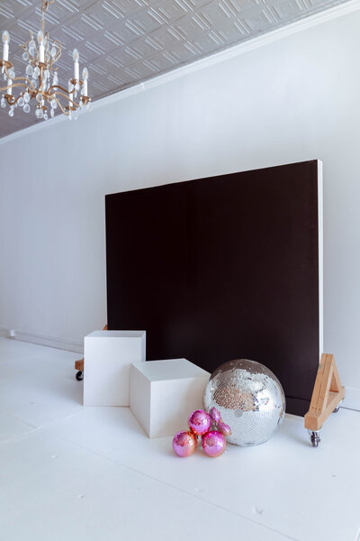 Natural-light photography studio with white walls and modern furniture in Troy, MO
