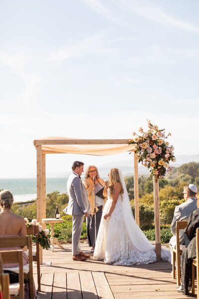Bride and groom take their vows on California coastline
