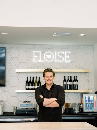 Picture of Tyler behind the bar