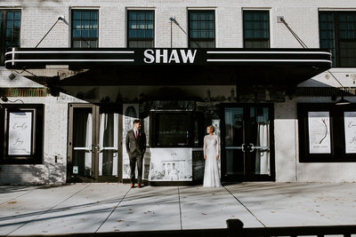 couples stand in front of venue