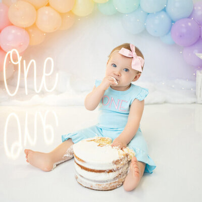 One year old cake smash with balloon banner