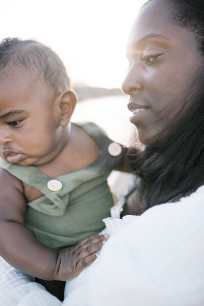 family Portrait taken at Big Talbot Island in Jacksonville with the mother in a creamy long dress while she snuggles her toddler