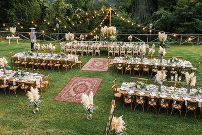 Wedding reception outdoor with decorative rugs