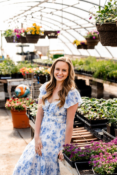 JaCee Petko, Christian life coach, smiling in a greenhouse