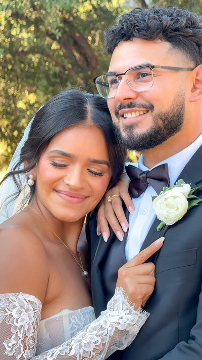 Bride and groom kissing during portraits at the San Diego Safari Park in Escondido, California.