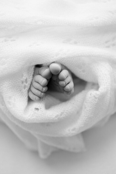 Black and white newborn baby sleeping by Miami Newborn Photography