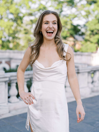 Bride and bridesmaid smiling together