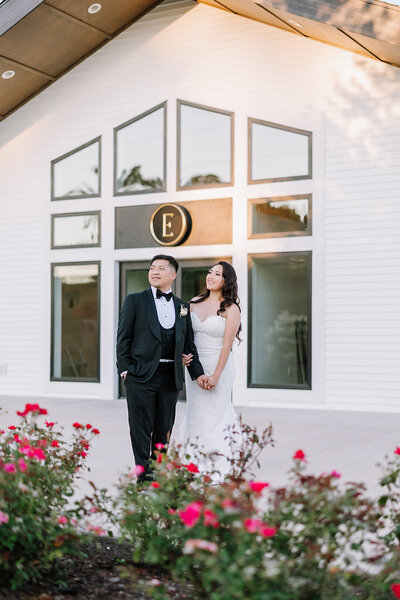 Photo of married couple standing outside The Eloise's front doors