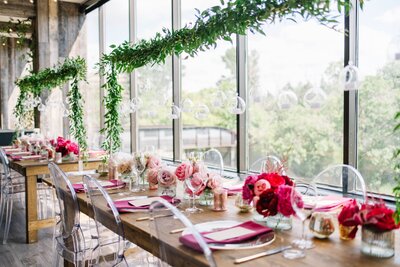 Colorful magenta centerpiece table setup at restaurant