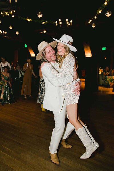 Southern California Wedding Photo with cowboy hat and boots on bride