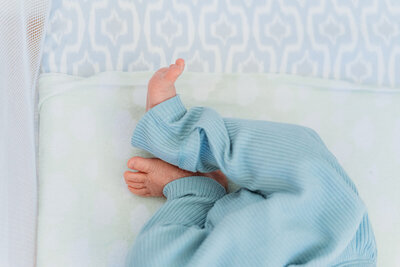 newborn baby's feet in crib taken during Philadelphia Newborn photography session
