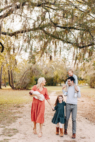 couple with their golden retriever during their engagement session