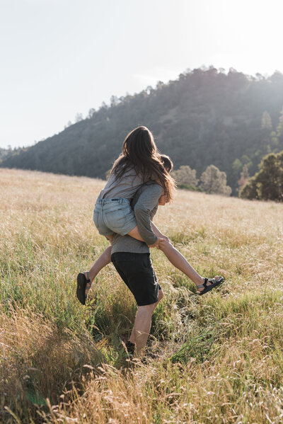man and woman adventuring in field