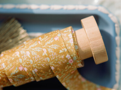 Yellow grosgrain ribbon featuring watercolor floral design by Laura Hooper