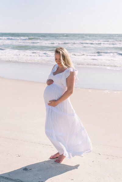 pregnant mother portrait on beach