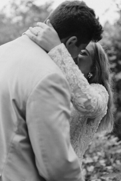 Candid moment between an eloping couple in nature, full of connection and emotion.