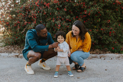 Brunette woman and Black father with their son at Tower Grove Park