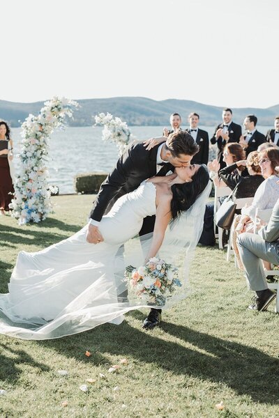 First kiss at a New England coastal wedding venue