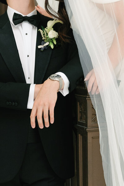 Close up of bride and groom's arms next to each other