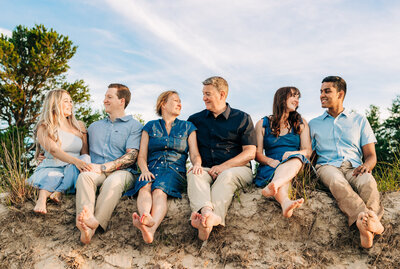 Family posing on the beach for portrait