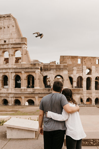 Abi and Josh in front of colosseum in rome