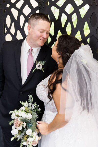 Ornate arch and table with wedding information