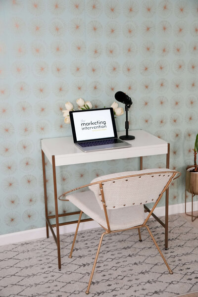 laptop-with-the-marketing-intervention-podcast-and-microphone-02