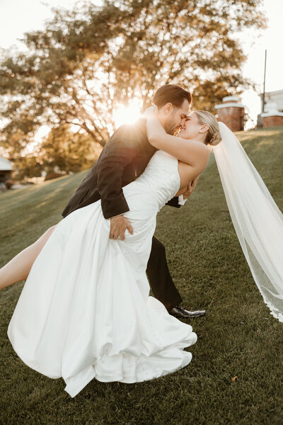 Bride and groom posing under the arch at Folino Estate Winery