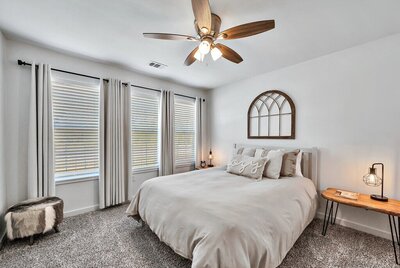 Bright and open bedroom with Queen size bed in this 2-bedroom, 1 bathroom vacation rental home located 4 minutes from delicious Magnolia Table and 5 minutes from the beautiful Baylor campus in Waco, TX