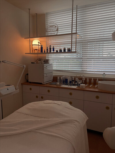 Interior look at med spa client chair and counter with products on it