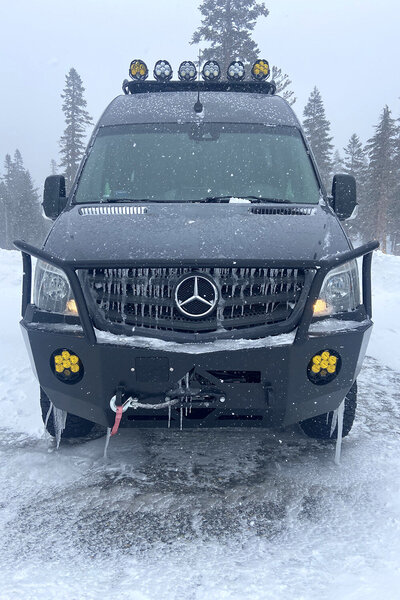Winter snow and mountain ready with a 4x4 drive system, life and fat tires on this camper van rental