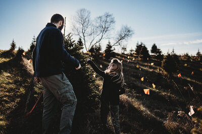 Helping Dad pick out the Christmas Tree