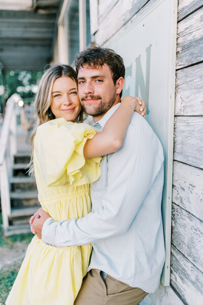 Couple holding each other close and smiling with their faces touching