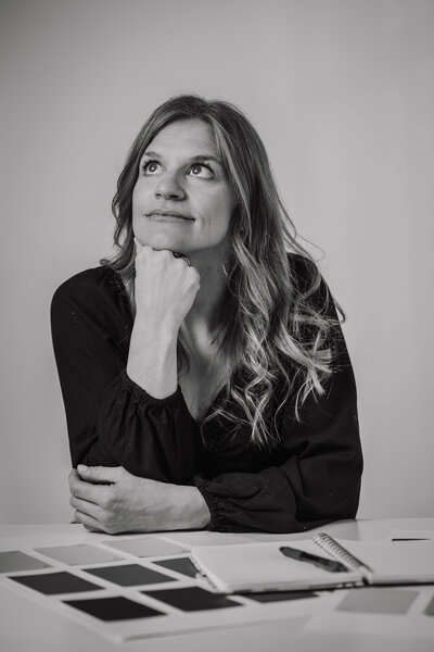Beth Requist, Winter Park custom web designer, black and white portrait of Beth with hand under chin
