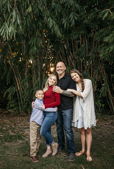 Photographer's family in Bonita Springs Florida posing for photographer