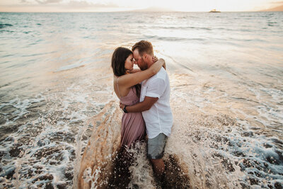 couple embracing in the ocean
