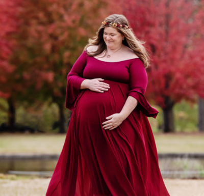 Maternity photoshoot in St Louis with mom in a red gown
