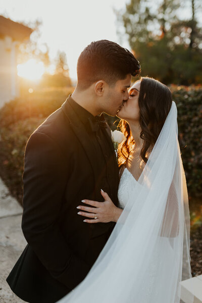 couple kisses at golden hour northern california wedding