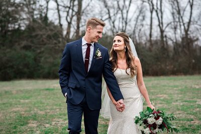 Newlyweds taking a stroll together on their wedding day