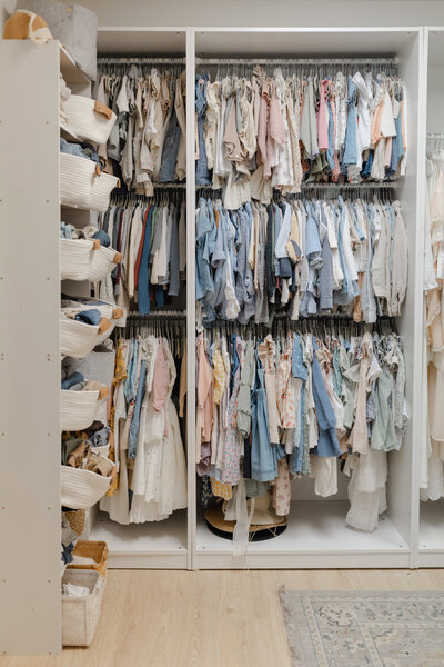 closet filled with children's clothing for family portraits