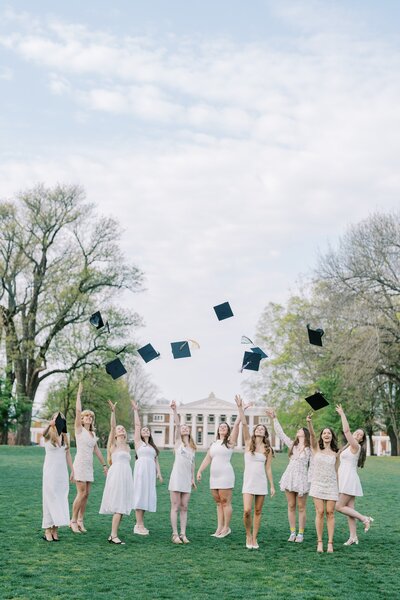 2 senior girls posing with heart hands