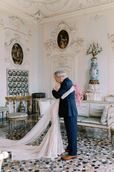 Father-daughter first look during a wedding in Villa Sola Cabiati in Lake COmo, by luxury destination wedding photographer Andreas K. Georgiou