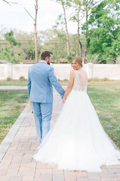 natural light newlywed portraits under in shaded at sprengergarten wedding venue