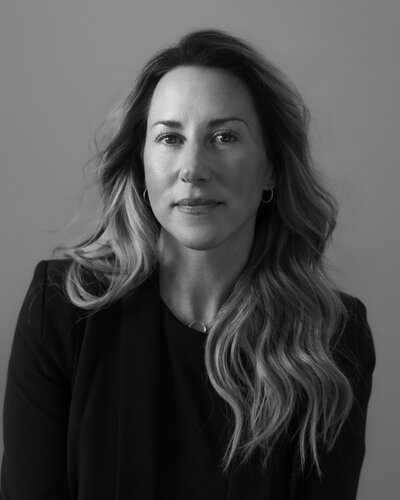 Portrait of Kate Lyster, owner and principal designer of Sandpoint's Base Camp Design, a leading interior design firm specializing in modern rustic and mountain Scandinavian styles.