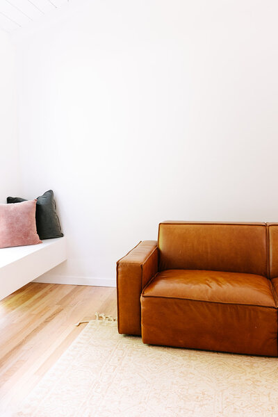 Leather Coach at Hannah's house - West Village Realty